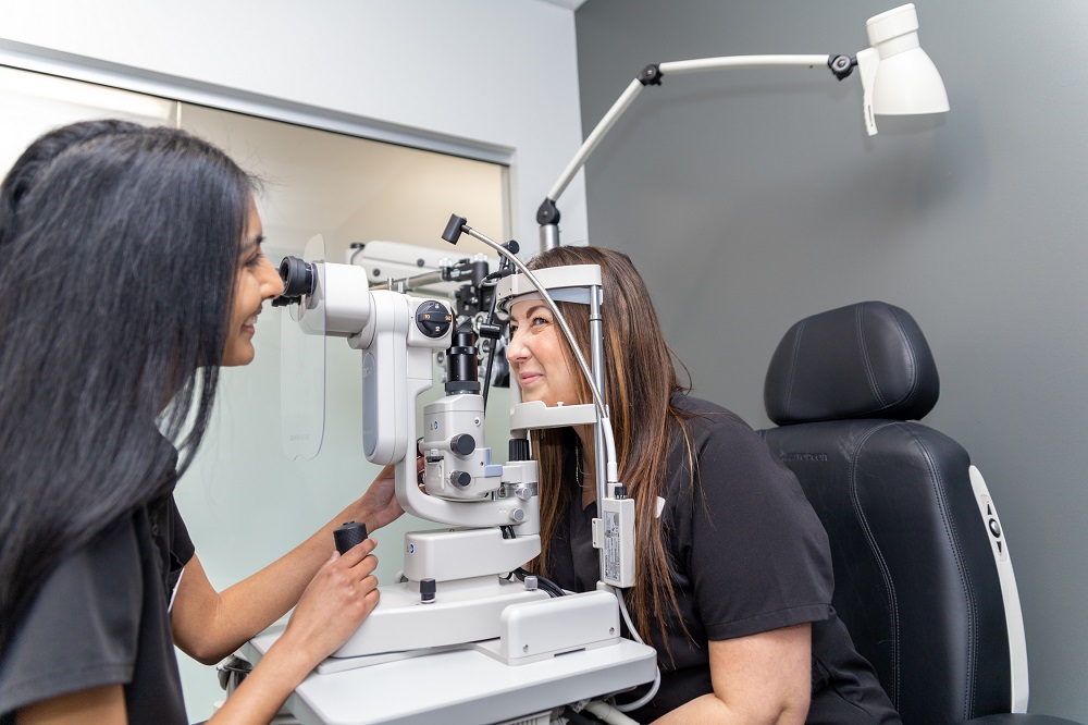 An eye care professional performs a slit lamp exam to closely inspect the patient’s cornea, lens, and overall eye health. This detailed evaluation is essential for diagnosing and managing conditions such as glaucoma, cataracts, and corneal disease – Ocular Disease Management.